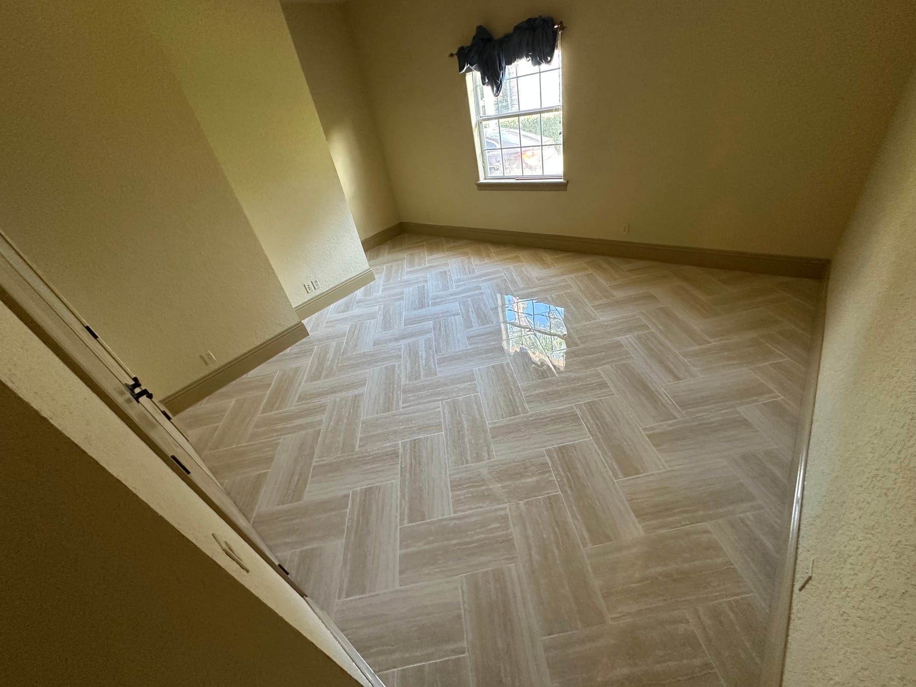 Warm herringbone flooring installed by JEG